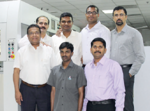 The Delta team with the company’s newly installed Bobst Novacut 106 die-cutter.